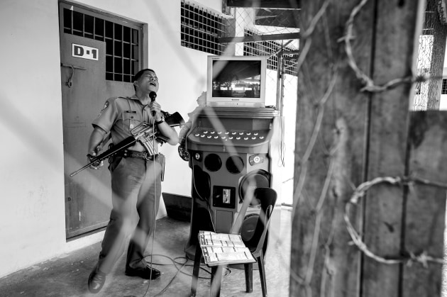 Prison guard performing karaoke, Malaybalay, Mindanao &ndash; Philippines. Image &copy; Michael Coyne.