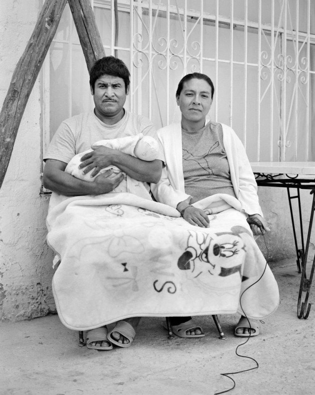 Victor Roman Castro (41) and Gertrudis Ortega Ramirez (38), take a portrait with their one-month-old daughter at the El Buen Samaritano migrants’ shelter in Juarez, Chihuahua, Mexico on 28 April, 2021. Photo by Gertrudis Ortega Ramirez and Adam Ferguson.