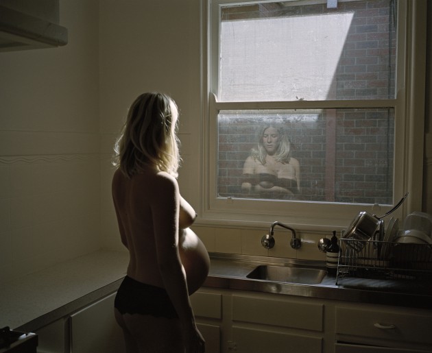 © Alana Holmberg. “Greta in her kitchen, 36 weeks (2018) from an ongoing series documenting my family.”