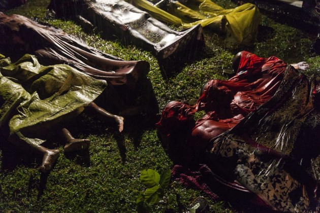 Rohingya Crisis. World Press Photo of the Year Nominee. &copy; Patrick Brown.  
The bodies of Rohingya refugees are laid out after the boat in which they were attempting to flee Myanmar capsized about eight kilometers off Inani Beach, near Cox's Bazar, Bangladesh. Around 100 people were on the boat before it capsized. There were 17 survivors.

The Rohingya are a predominantly Muslim minority group in Rakhine State, western Myanmar. They number around one million people, but laws passed in the 1980s effectively deprived them of Myanmar citizenship. Violence erupted in Myanmar on 25 August after a faction of Rohingya militants attacked police posts, killing 12 members of the Myanmar security forces. Myanmar authorities, in places supported by groups of Buddhists, launched a crackdown, attacking Rohingya villages and burning houses. 
Commissioned by Panos Pictures, for UNICEF.