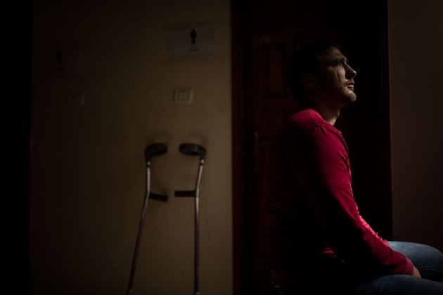 &copy; Darrian Traynor, from the series, 'More than skin deep'. GAZA. 3rd March 2020. Mohammed Abu Jarad was shot through the leg in December 2017 while protesting at the fence against the U.S. announcement to move its embassy from Tel Aviv to Jerusalem. He was standing close to the well-known activist and wheelchair-bound Palestinian demonstrator, Ibraheem Abu Thuraya who was killed during the protest. The explosive ammunition caused massive damage, including extensive blood loss, bone loss, and nerve damage. He comes to the clinic three times a week to receive therapy on the muscles around his wound and manage the pain.