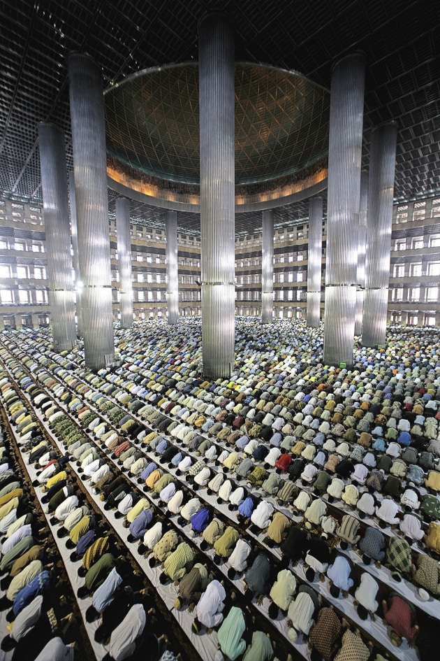 &copy; Ahmad Zamroni. Muslims at prayer, Jakarta. More than 90 percent of Indonesia's some 220 million people follow Islam, making it the worlds biggest Muslim nation. 2007, from the Untitled series 2007, pigment inkjet print, 139 x 64 x 5.5 cm.