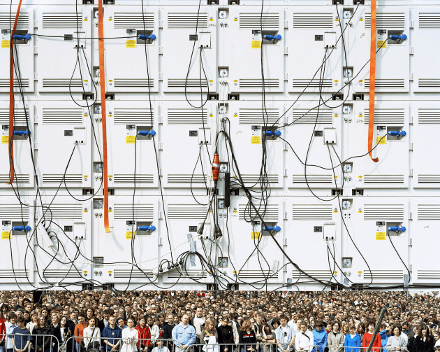 &copy; Mark Power/Magnum Photos. Crowds watch the funeral of Pope John Paul II, broadcast live from the Vatican on large video screens. Warsaw, Poland, 2005, from the The Sound of Two Songs series 2005, pigment inkjet print, 106.7 x 134 x 4.4 cm. Courtesy of Magnum Photos London.