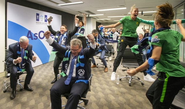 FFA & Australian Bid Team Members Watch The 2023 FIFA Women's World Cup Host Announcement. Chris Nikou, Chairman of Football Federation Australia (C) along with officials and players react as FIFA announced Australia as the hosts to the 2023 FIFA Women's World Cup at the FFA Offices on June 26, 2020 in Sydney, Australia.