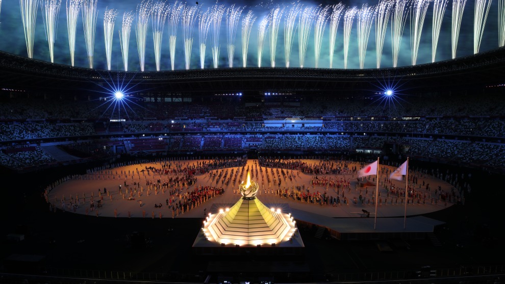 Image by Cameron Spencer/Getty Images. Opening Ceremony - Olympics Day: 1. Cameron Spencer mounted his camera on a metal bar directly in front of him and used a very slow shutter speed and small aperture high aperture capture the streaking fireworks and the lighting of the Olympic torch.