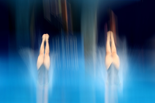 Image by Al Bello/Getty Images. Diving - Olympics Day: 3. Getty Images Staff Photographer is an expert in covering aquatic sports and this picture is case and point. Here, Al is able to show the beauty and symmetry of synchronized diving as Haruka Enomoto and Hazuki Miyamoto of Team Japan compete during Women's 3m Springboard Finals on day two of the Tokyo 2020 Olympic Games.