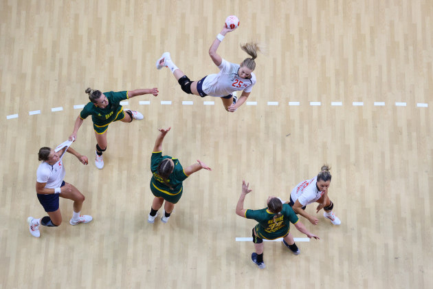 Richard Heathcoate/Getty Images, Handball - Olympics Day: 7. “It’s a bird, it’s a plane, its… Kristine Breistoel of Team Norway’s Handball Team! In this photo, Getty Images Staff Photographer Richard Heathcoate timed the use of his remote camera perfectly to capture Breistoel as she soars toward goal during the Women's Preliminary Round Group A handball match between Montenegro and Norway on day six of the Tokyo 2020 Olympic Games.