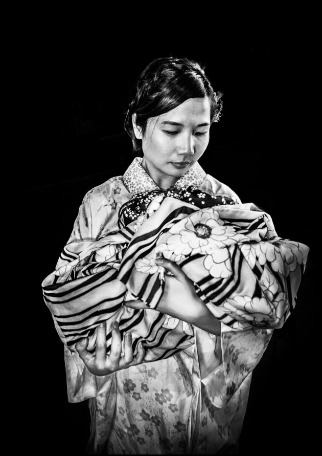 MOTHER AND CHILD, KYOTO: This image appears to symbolise traditional Japan but the woman has removed her kimono as it is the middle of Summer and she is hot. Things are not as they seem. She is carrying her kimono lovingly like a baby. Image: Meg Hewitt