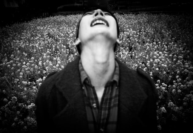 YOKO IN SPRING, TOKYO: Yoko throws her head back to gesture a great release. Her gesture holds part joy and part pain. She is in a field of spring flowers but the anniversary of The Great East Earthquake and Tsunami reminds her of her mothers death.
Image: Meg Hewitt