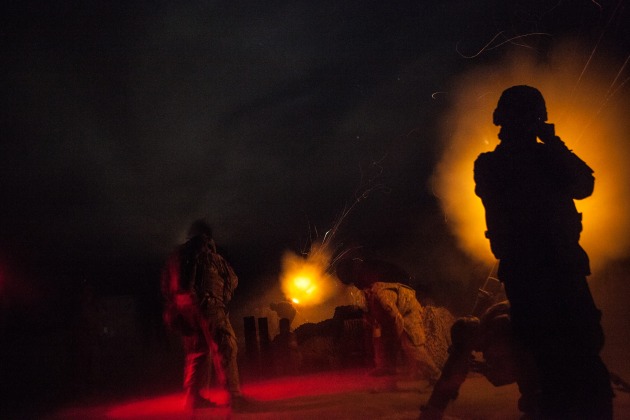 © Erin Trieb. US soldiers of a mortar platoon (Alpha Company, 39th Brigade Engineer Battalion, 2nd Brigade Combat Team, 101st Infantry Division) engage in firing illumination mortar rounds as a part of the US military's 