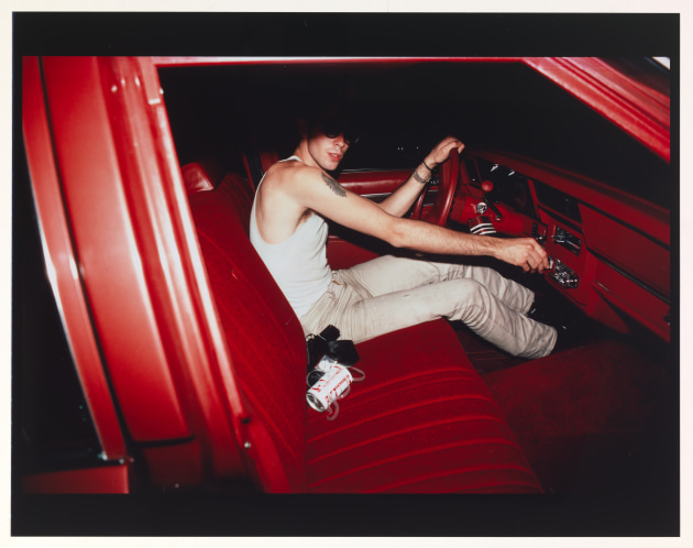Image: Nan Goldin, Mark in the red car, Lexington, Massachusetts, 1979. (Supplied by NGA)