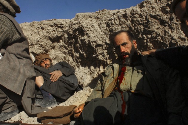 © Ron Haviv/VII. Northern Alliance soldiers tend to a dying commander in the assault on the Taliban stronghold of Maidan Shar, overlooking the road to Kandahar. The Northern Alliance withdrew after sustaining casualties and being outflanked by the Taliban. 22 November, 2001.