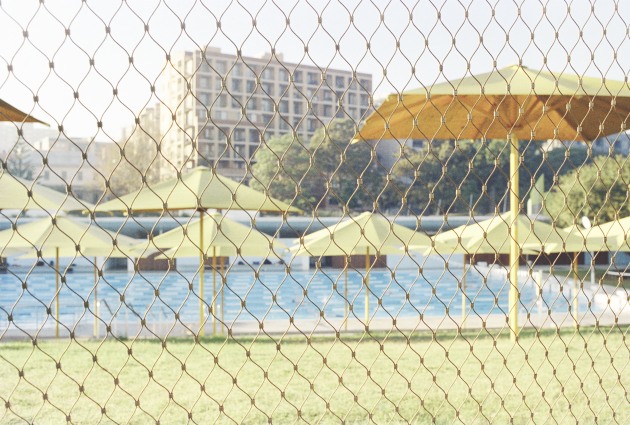 Social space.
When I took this photograph, during the Covid lockdowns, I was thinking a lot about shared spaces that we occupy. I have recently heard the term “third place”. In sociology, third place refers to the places we inhabit that are not home (first place) and not the work place (second place). These spaces include places such as gyms, cafes, bars, clubs, theatres, and cinemas. Third places are important for community interaction. These are places where we generally try to relax. They are accessible and inclusive spaces. Here I have captured a third place in the local swimming pool. 
This photograph was exhibited at the Rotterdam Photography Festival in Amsterdam.