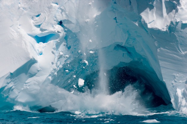 Southern Ocean, Antarctica, 2010.
The front edge of an iceberg collapses into the surrounding ocean.
My camera was sitting on my strap as the iceberg started to collapse. I quickly grabbed it from my waist, and shooting from the hip, I continuously pressed the shutter button whilst moving my camera in an arc shape hoping to level out the horizon in the arc movement to capture the collapse of the ice. Image: Glenn Lockitch